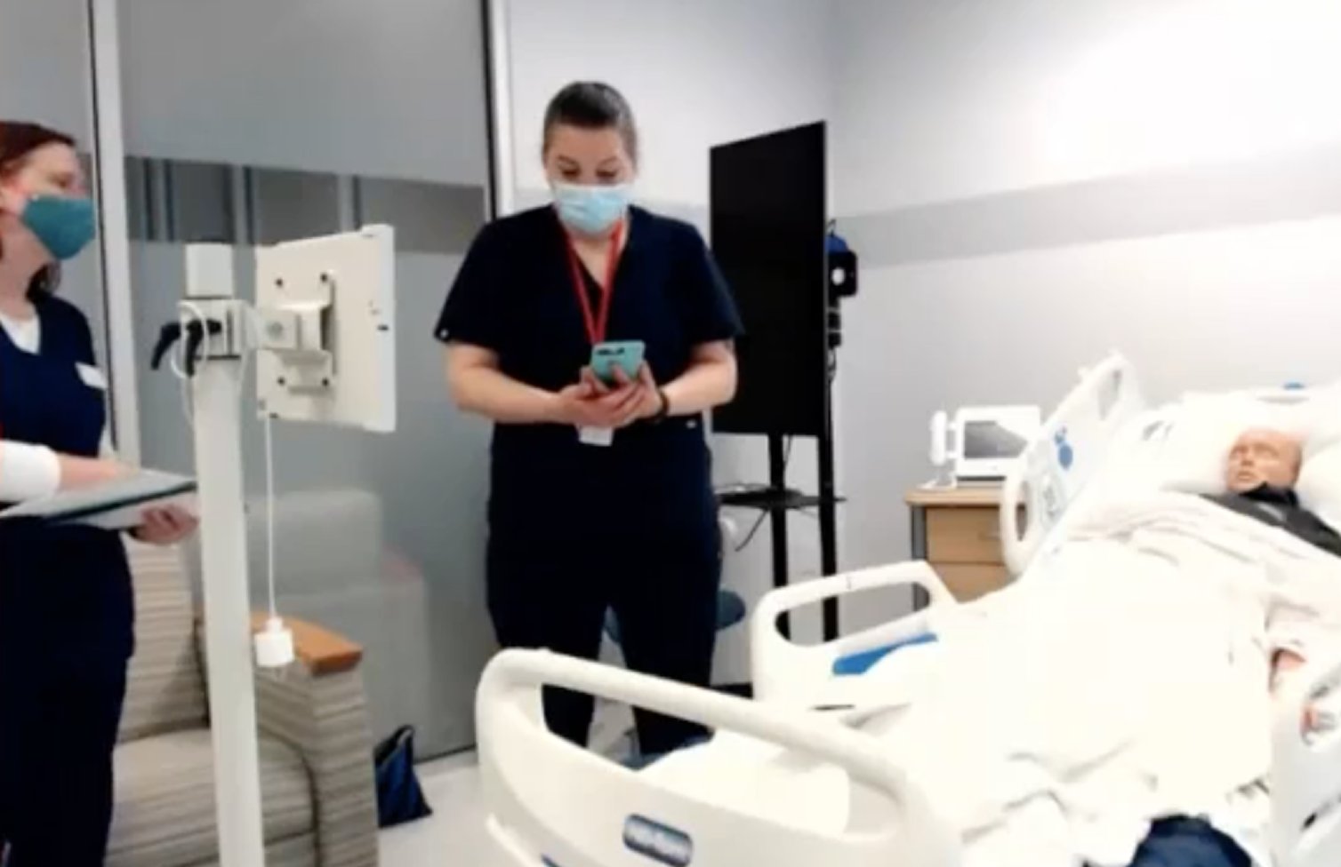 Nurse testing the Voalte Family prototype in a simulated hospital room